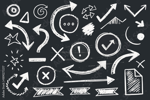 White chalk crayon doodles of arrows circles chevrons on blackboard 1