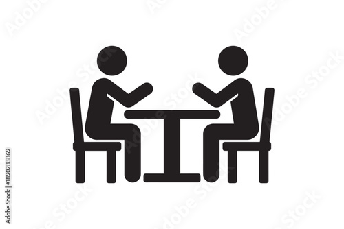 Two people sitting at table talking silhouette icon representing business meeting or dinner date