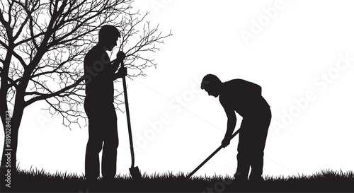 Silhouette of two male gardeners working outdoors digging with shovels near a bare tree on a grass field for landscaping and gardening concepts.