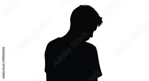 Silhouette of a man with his head bowed in contemplation