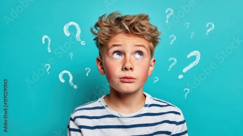 A boy with curly hair and a striped shirt gazes upward, displaying a look of confusion or curiosity. The vibrant blue background features playful question marks around him.