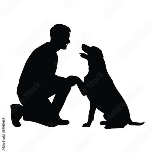 Silhouette of a man interacting with his labrador retriever companion