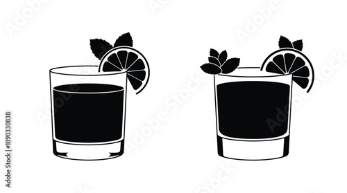 Two dark cocktails with citrus garnish a striking black silhouette