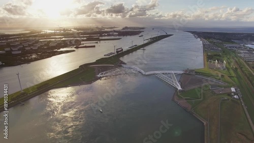 Aerial Drone View of Maeslantkering Storm Surge Barrier and Port of Rotterdam at Sunset, Netherlands