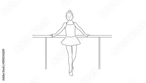 A young ballerina in a pink dress stands at the ballet barre