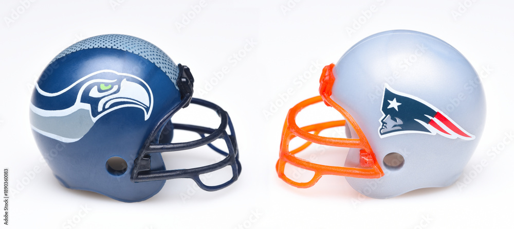 Naklejka premium IRVINE, CALIFORNIA - 26 JAN 2026: Football helmets of the Seattle Seahwwks and the New England Patriots, opponents in Super Bowl LX .