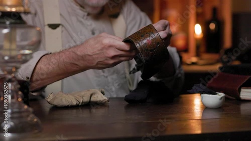 cowboy in his cabin cleaning spurs