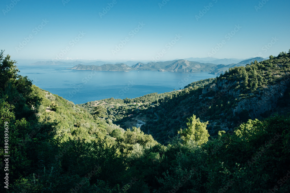 Naklejka premium A picturesque bay surrounded by forested mountains in Turkey