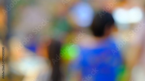 Wallpaper Mural A blurry image of people in a crowded area. The people are wearing blue and green clothing. Scene is busy and chaotic Torontodigital.ca