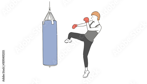 A woman in a grey tank top is kicking a punching bag with red boxing gloves