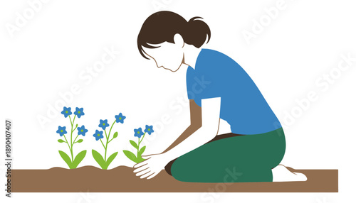 A woman kneeling down to plant flowers in the soil outdoors