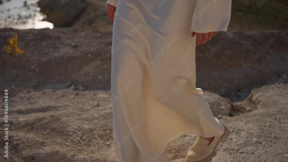 custom made wallpaper toronto digitalA woman in a white dress walks along the riverbank. The concept of a female gait.