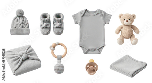 Flat lay of gray baby essentials including hat, booties, onesie, teddy bear, blanket, rattle, pacifier on white background, perfect for newborn announcements
