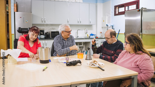 Konstfotografi Diverse adults with disabilities participating in a cooking workshop in a kitche