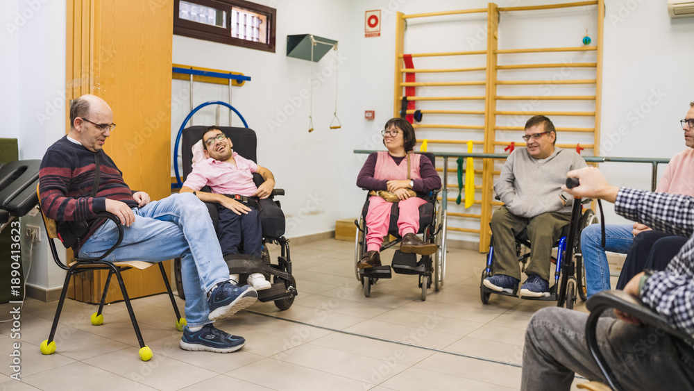 © DMegias - Group of diverse people with disabilities participating in a support meeting or therapy session at a rehabilitation center