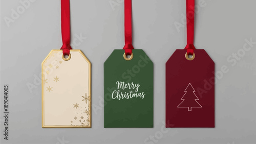 Three Christmas gift tags with different designs hanging from red ribbons on a gray background