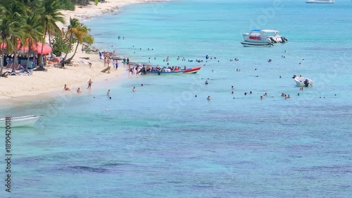 Wallpaper Mural Panning view of Catalina beach and boats moored near the shore, Caribbean sea and beautiful sandy beach,Tropical beach.Catalina island.Dominican Republic.summer concept. Torontodigital.ca