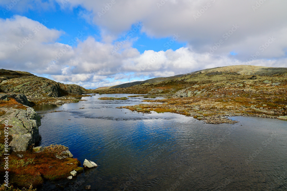Fototapeta premium Peaceful Scandinavian highland landscape. Mountain River and Plateau on Aurlandsfjellet Tourist Route, Aurland, Vestland county, Norway. 