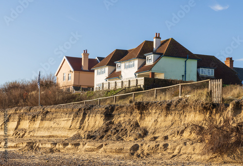 Coastal and cliff erosion on the beach causing a potential danger to properties at the top of the cliff at Thorpeness, Suffolk. UK