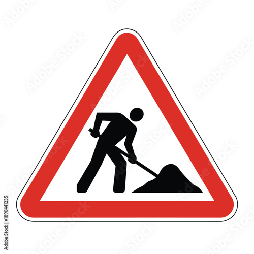 A triangular road sign depicting a worker with a shovel and pile