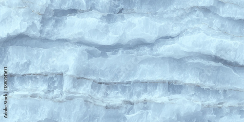 A frozen blue ice texture on the river surface creates an abstract winter pattern of white frost and crystal macro details under a cold nature sky