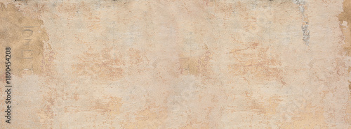 Weathered beige stucco wall background with grunge texture