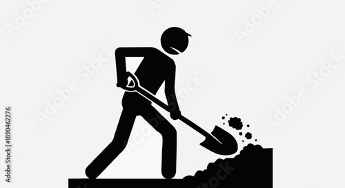 Silhouette of a person digging with a shovel.