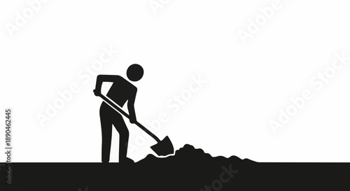 Silhouette of a person digging a pile of dirt with a shovel.