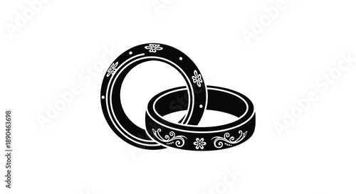 Two ornate wedding rings are intertwined against a white background forming a visually striking silhouette high quality professional detailed modern elegant