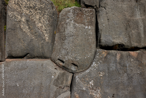 Photos detail close-up of the megalithic stone masonry at the fortress of Sacsayhuamán, located on the outskirts of Cusco