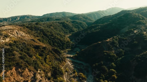 dry riverbed among the green hills