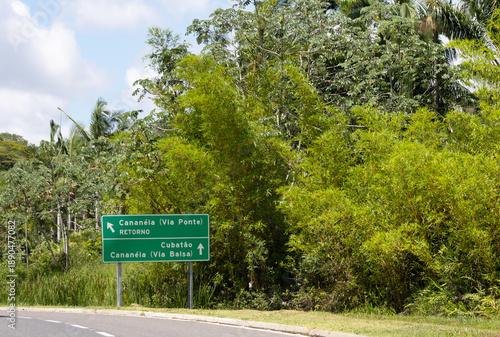 A sign on the side of a highway reads 