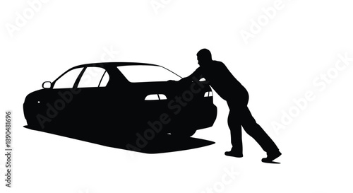 Man pushing a stalled car on a road black silhouette