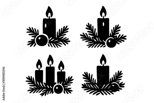 Four black silhouette burning candles surrounded by festive Christmas fir branches and ornaments