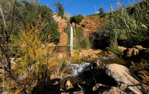 A waterfall in the heart of nature, a beautiful river and waterfall . The Queda do Vigario waterfall near Alte, Algarve, Portugal