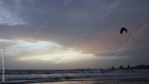 Kitesurfing at sunset, freedom and adventure