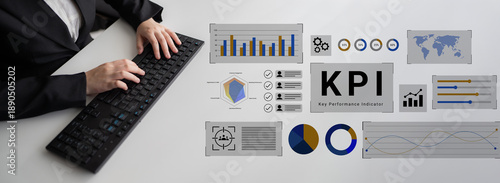 Quadro em tela A business professional reviews key performance indicators (KPI) with detailed graphs and charts displayed on a modern office workspace
