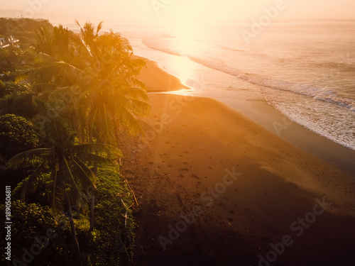 Wallpaper Mural Drone view of sand beach with sunset tones and ocean Torontodigital.ca