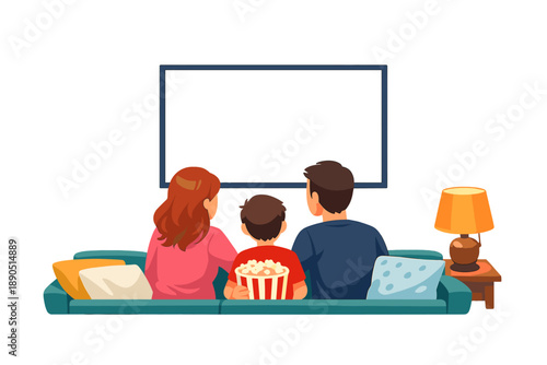 Family enjoying movie time together at home with popcorn and cozy sofa in the living room during a weekend evening