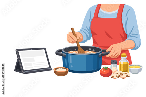 Person cooks a meal in a kitchen while following a recipe on a tablet with various ingredients on the table