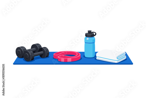 Fitness equipment is arranged on a blue mat with dumbbells, a resistance band, a water bottle, and towels ready for workout use at a gym or home setting during the day