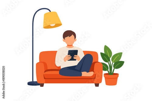 Person sits on couch with smartphone by lamp and plant in living room during evening time at home