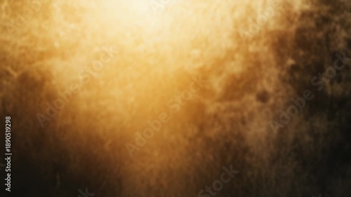Golden textured surface revealing glittering sparkles and rough details, creating a warm, abstract background with a gradient light effect from top to bottom