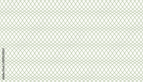 A subtle, seamless vector pattern of light green intersecting curved line. This elegant thin line quatrefoil design or snake skin is ideal for sophisticated background, fabric, wallpaper.