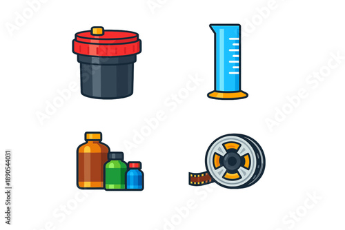 Objects related to film development and chemical processing used in photography found in a workspace setting