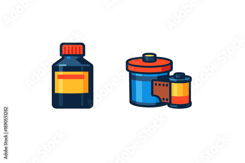 Bottle of camera film developer next to canister of color film with strip of film