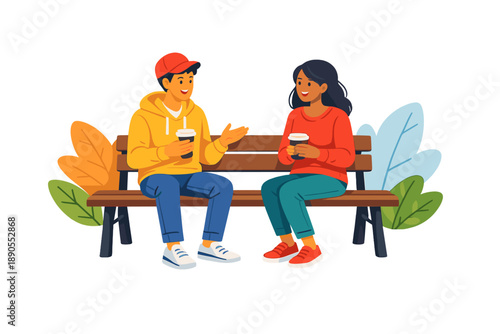 Two people talk and enjoy warm drinks while sitting on a bench surrounded by colorful leaves in an outdoor setting during a sunny day