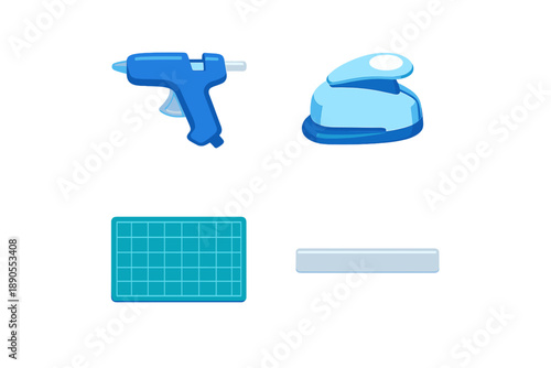Various crafting tools are arranged on a white surface showcasing a glue gun, tape dispenser, cutting mat, and straight edge ruler for crafting activities