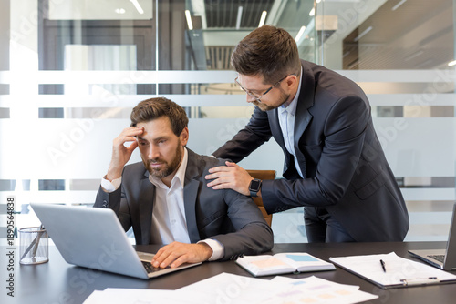 Фотография Business professional experiencing stress and receiving empathetic support from