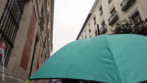 Billede på lærred Urban rainy day scene with umbrella on city street
